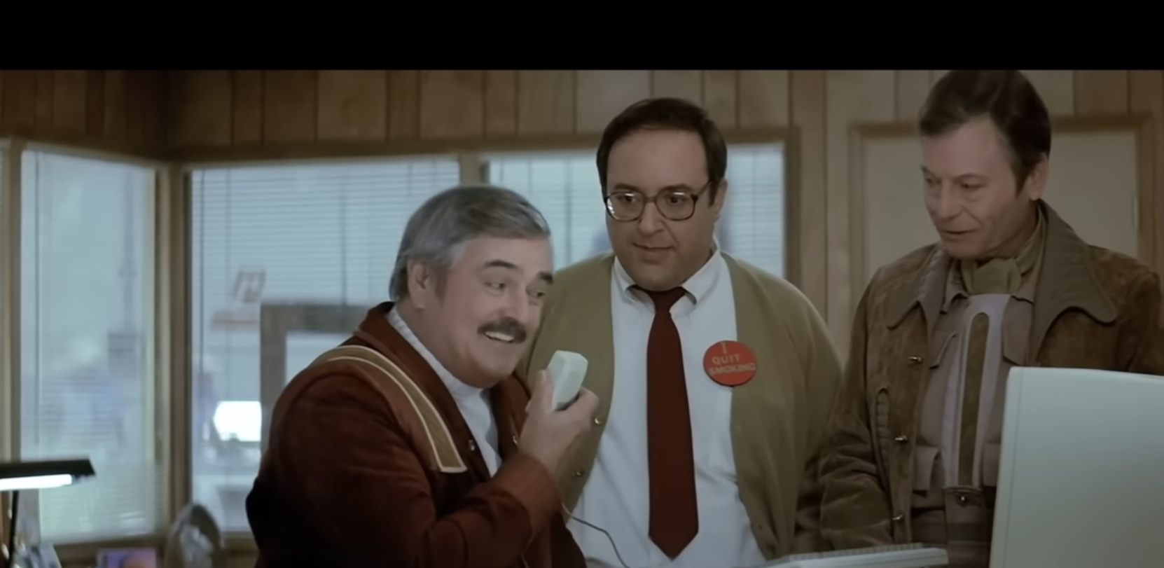 Scotty talking into a mouse — Star Trek IV: The Voyage Home